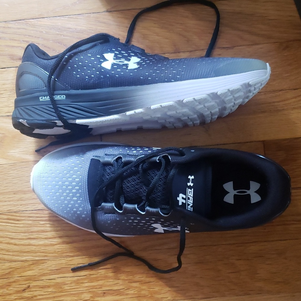 UA sneakers. 9.5 women.  Pre owned, never used.